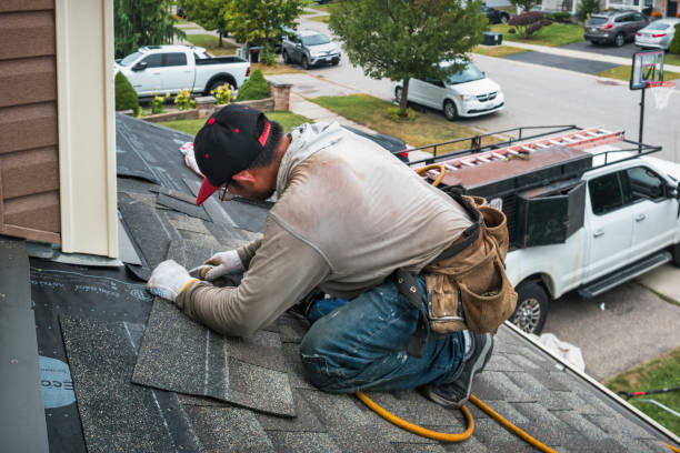 Professional Roofing technician working in Mc Veytown, PA